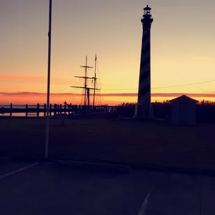 a lighthouse at sunset