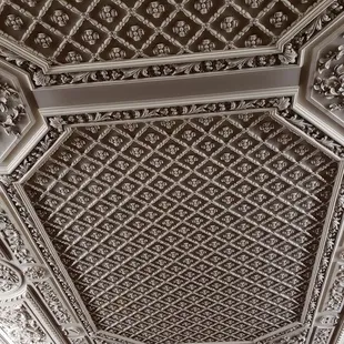 Hand carved woodwork on the ceiling of the music room.