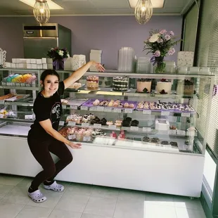 Owner standing in front of business