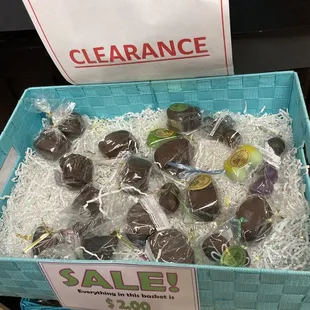 a basket of chocolate covered apples