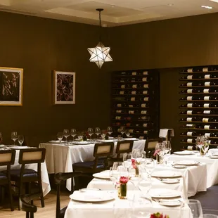 a dining room with tables and chairs