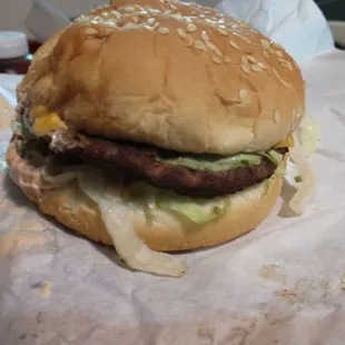 My other takeout burger. Yah, I ate one. It&apos;s the holy cow-bacon cheese. This is it&apos;s good side, the patty is a little askew. Tasty as heck.