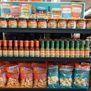 a grocery store shelf with a variety of food items