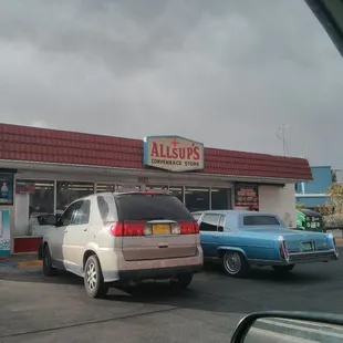 cars parked in front of a restaurant