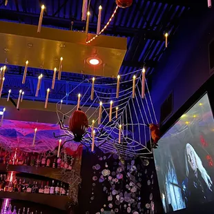 a spider web hanging from the ceiling