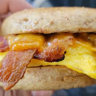 Classic breakfast sandwich with bacon for the meat and bagel for the bread