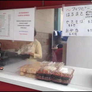 a woman behind the counter