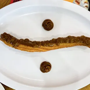 Churro with Dulces de Leche drizzle