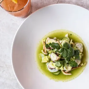 Shellfish ceviche with apple, grapes, jicama, cucumbers, avocado &amp; apple-tomatillo aguachile.