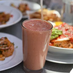 a smoothie and a plate of food