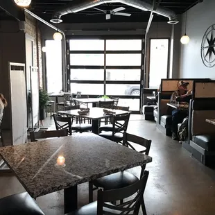 people sitting at tables in a restaurant