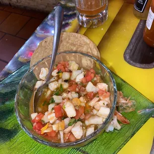 a bowl of salsa and tortillas