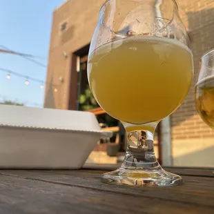 two glasses of beer on a table