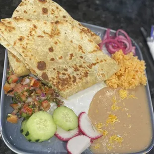 Chicken quesadilla with rice, refried beans, pico de gallo