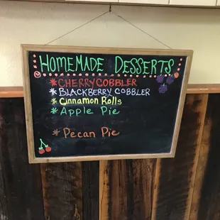 a chalkboard with a sign that says homemade desserts