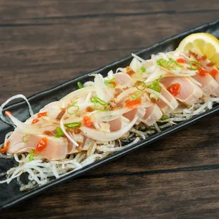 Savor the exquisite flavors of our Tuna Tataki: seared tuna with zesty citrus soy. A culinary delight that will leave you wanting more!