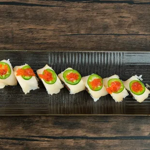 Unleash your taste buds with our Tiger Eyes roll! Mouthwatering combination of spicy tuna, creamy avocado, and a touch of fiery sauce