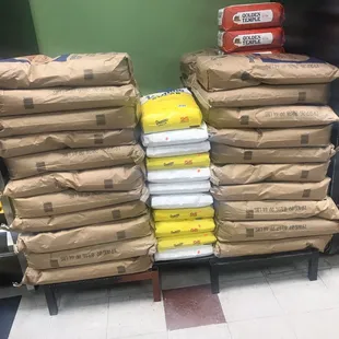 a large stack of bags of food