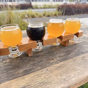 Flight of hazys and their one dark beer