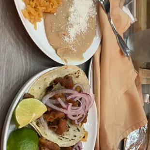 Tacos de tripas with rice and beans on the side