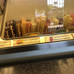 a variety of foods in a display case