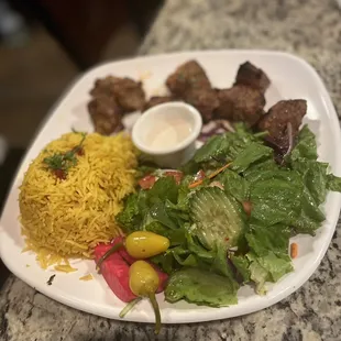 Beef kabob plate with rice and salad