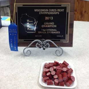 a plate of sliced sausages