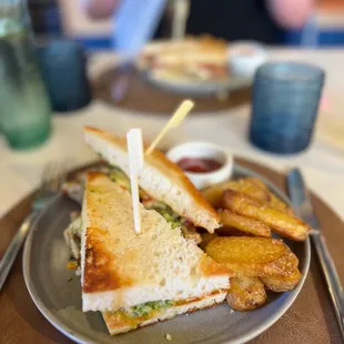 a sandwich and fries on a plate