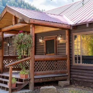 a cabin with a red roof