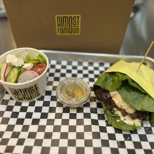 Smash burger protein style with a fresh side salad