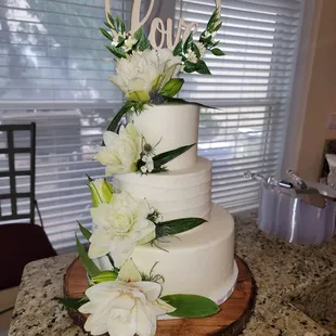 a wedding cake with white flowers