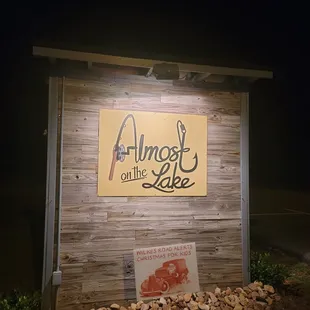a sign for almost on the lake
