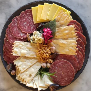 a platter of meat and cheese