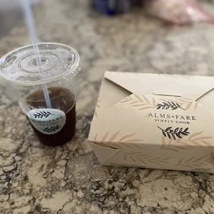 a drink and a box on a table