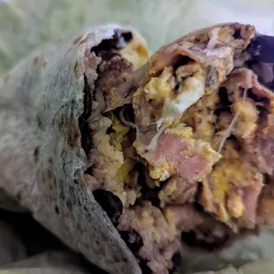 Jamón breakfast burrito (beans, rice, cheese, eggs, ham)
