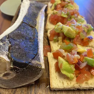 Bone marrow bruschetta. Pure, drippy, buttery beefy bliss on toast with stuff. It&apos;s amazing. Get it.