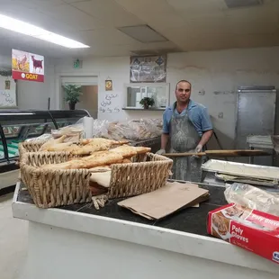 a man standing in a bakery