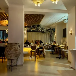 a dining room with people sitting at tables