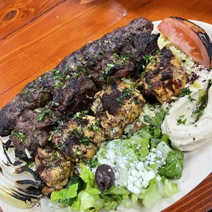 Kofta beef, lamb and chicken with hummus and Greek salad. Off the chain good!! Flavors galore.