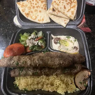 Kabob, salad, hummus and rice