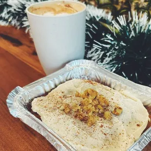 Homemade carrot cake with cashew frosting! Topped off with crushed walnuts and cinnamon