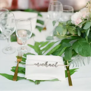 Calligraphy name cut-out place settings to help personalize your event.