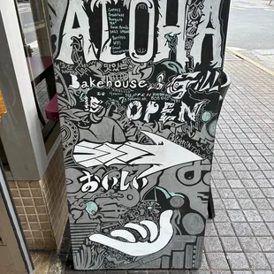 a sign on the sidewalk