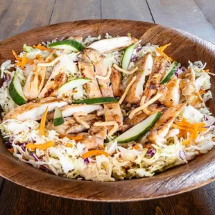 a salad in a wooden bowl