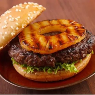 a burger with a pineapple on top