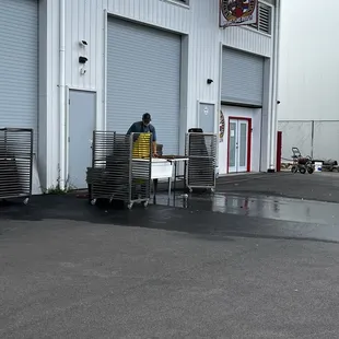 Outside worker cleaning racks