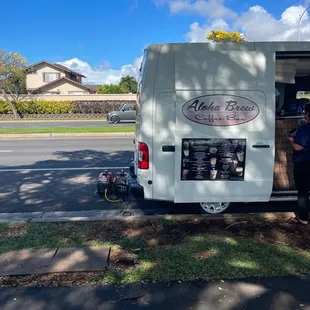 a man standing in the back of a van