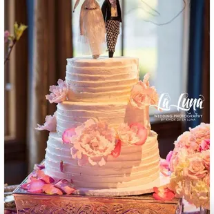 3 tier cake with sugar peony flowers. Matched my wife's bouquet.