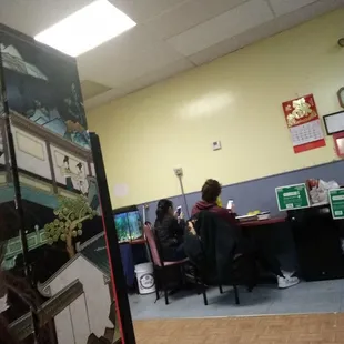 Doing what the employees here do best, playing with their phones.