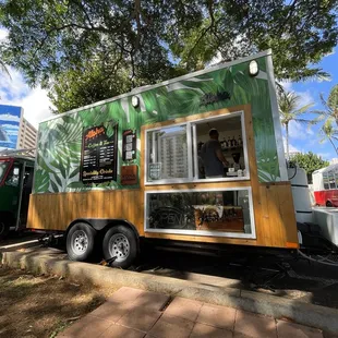 a food truck parked on the side of the road